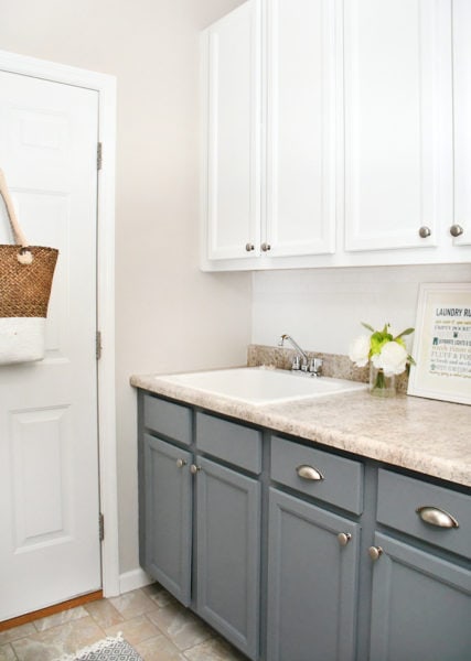 https://howtonestforless.com/wp-content/uploads/2017/08/laundry-room-gray-cabinets-427x600.jpg