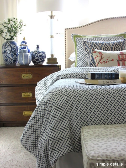 Patterned bed spread in master bedroom.