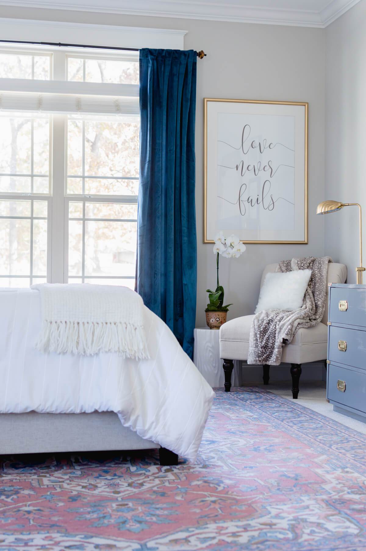 White and blue decor in master bedroom.