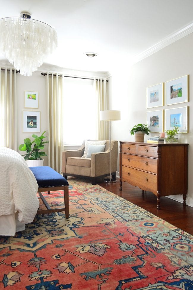 Multicoloured rug in master bedroom.