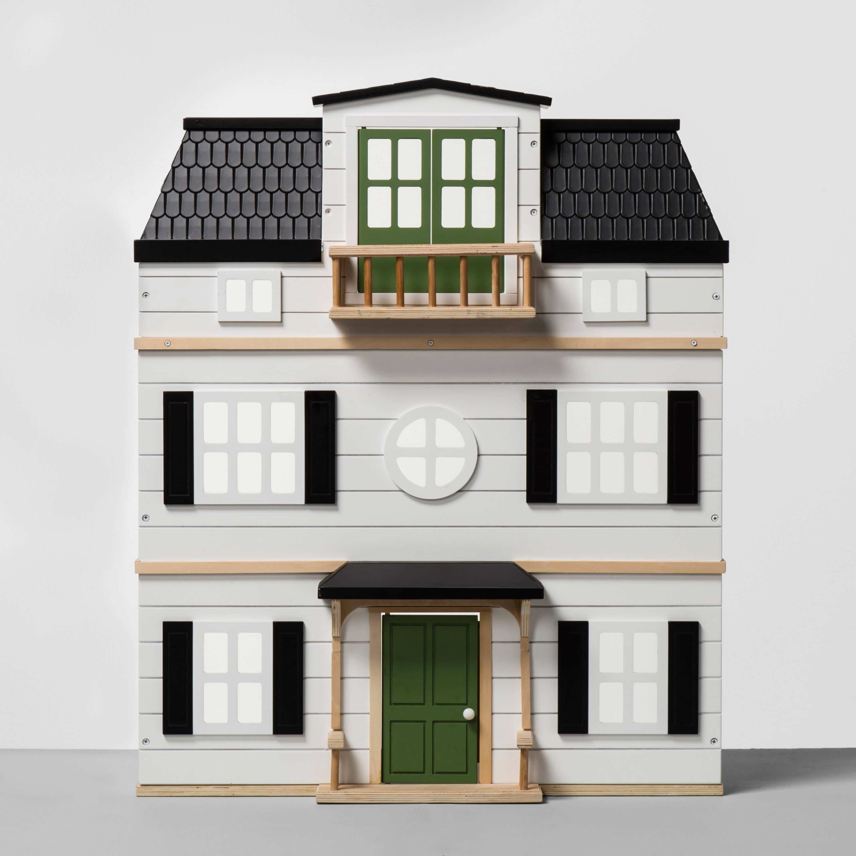 Wooden home dollhouse with a black roof and green doors.
