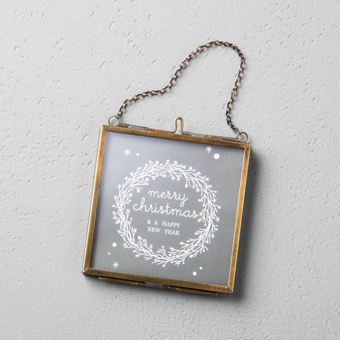 A glass photo frame ornament.