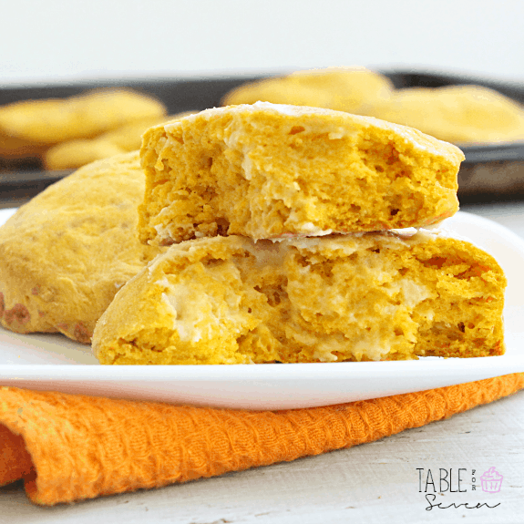 Pumpkin cheddar cheese biscuits on a plate.
