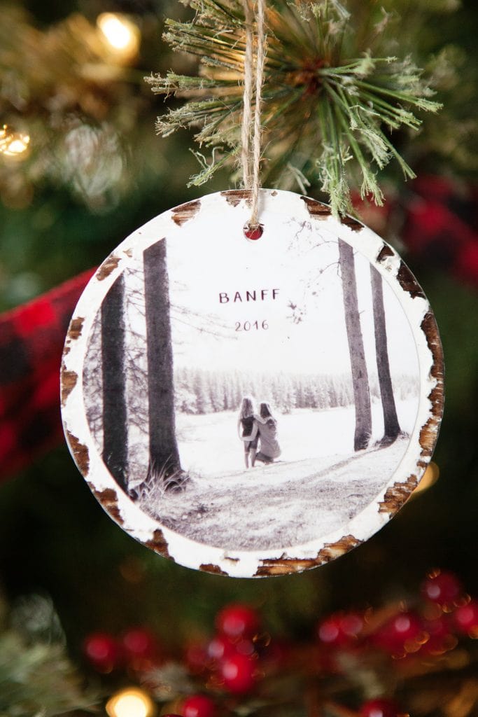 A photographic ornament hanging on the tree.