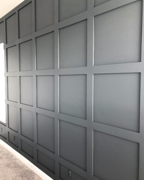 grid accent wall painted dark gray