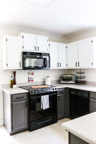 upper white cabinets and lower cabinets painted Sherwin Williams Peppercorn