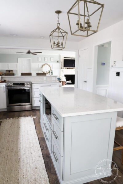 Sherwin Williams Oyster Bay kitchen island with white countertops