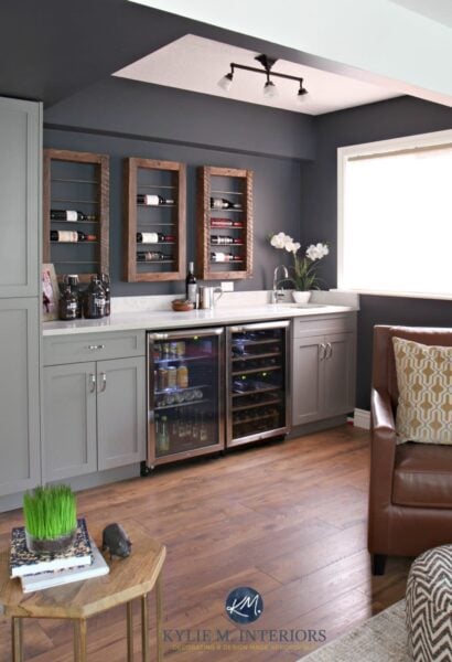 wet bar with built in wine fridge and mid toned floors