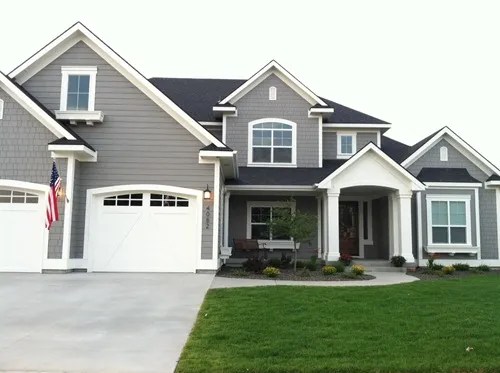 exterior of 2 story home painted sherwin williams dovetail and lush green grass