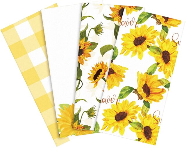 four kitchen towels decorated with sunflowers